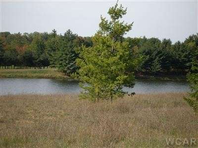 0.7 Acres of Residential Land for Sale in Canadian Lakes, Michigan