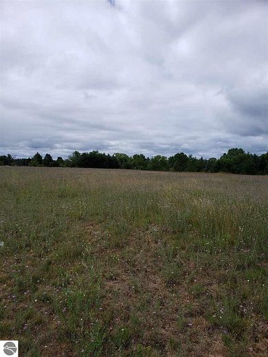 12.8 Acres of Commercial Land for Sale in Grawn, Michigan