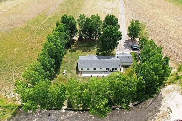 37.716 Acres of Agricultural Land with Home for Sale in Montrose, Colorado