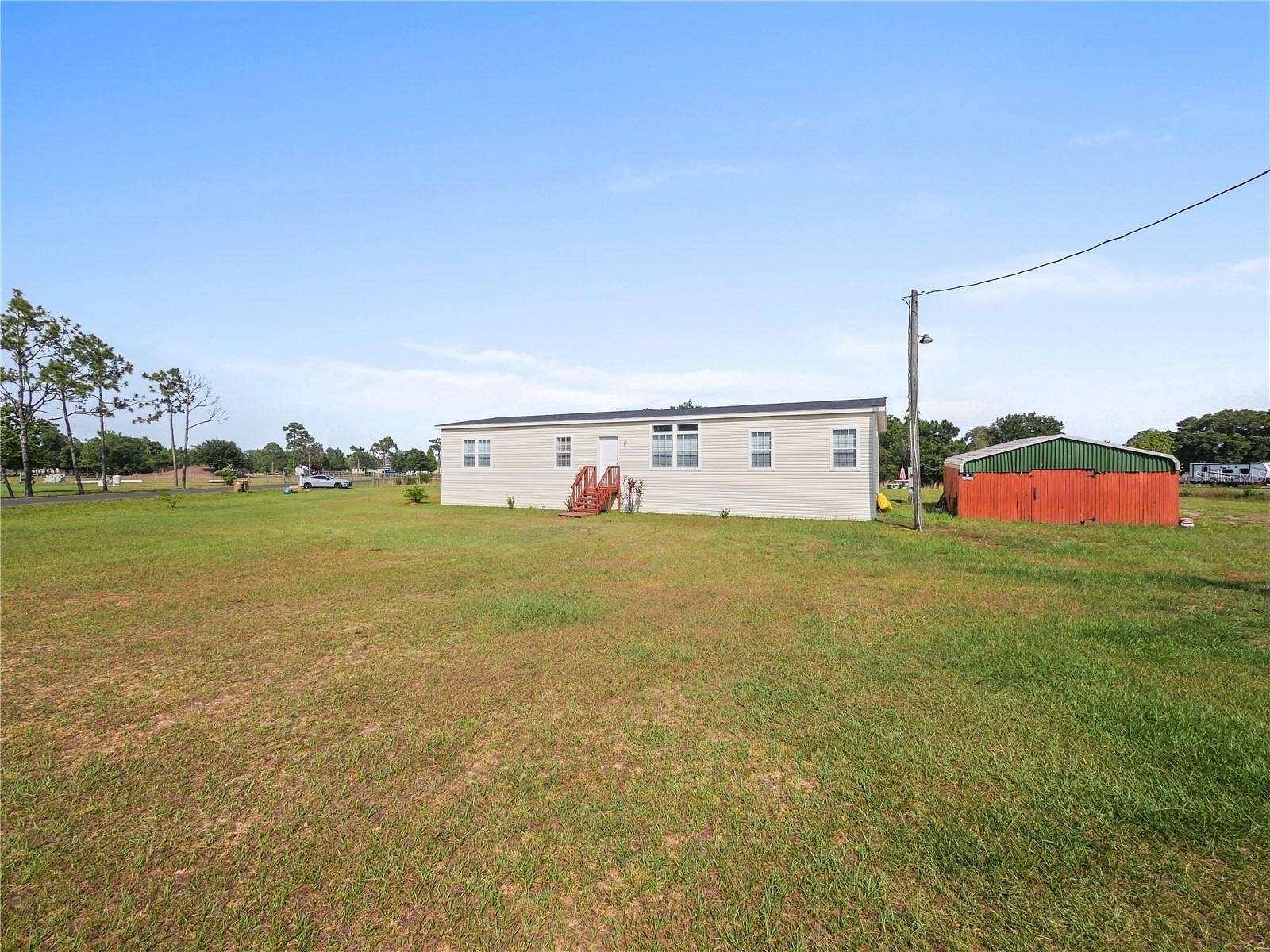 2.4 Acres of Residential Land with Home for Sale in St. Cloud, Florida