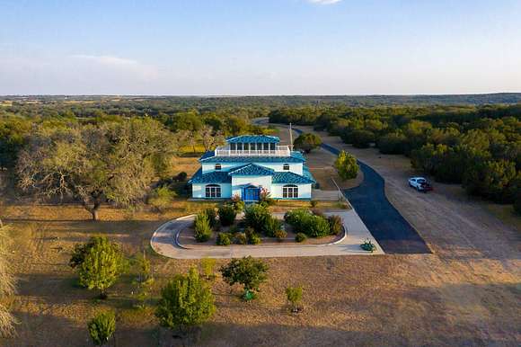 79.9 Acres of Agricultural Land with Home for Sale in Hamilton, Texas