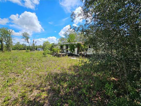 4.3 Acres of Residential Land with Home for Sale in Bronson, Florida