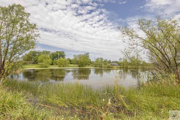 10.09 Acres of Recreational Land with Home for Sale in Paris, Texas