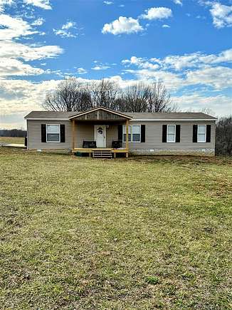 2.4 Acres of Residential Land with Home for Sale in Scottsville, Kentucky