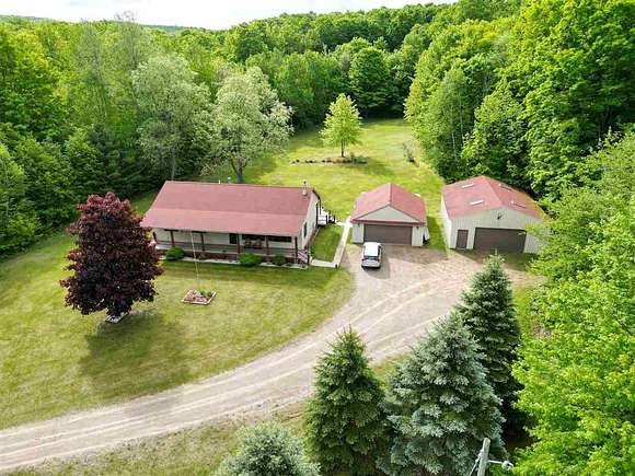 14.3 Acres of Land with Home for Sale in Boyne Falls, Michigan