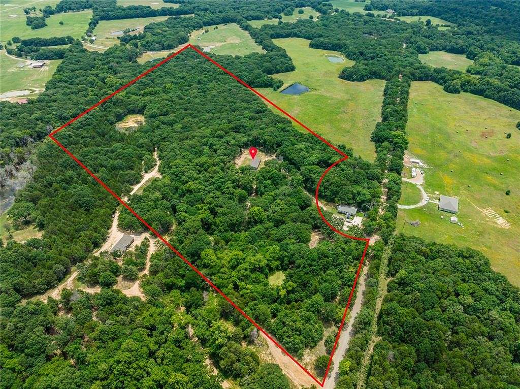 15.714 Acres of Recreational Land with Home for Sale in Ravenna, Texas