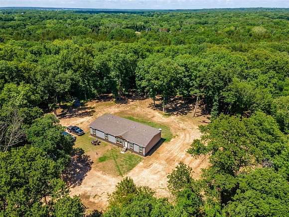 15.7 Acres of Land with Home for Sale in Ravenna, Texas