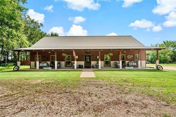 6.9 Acres of Residential Land with Home for Sale in Powderly, Texas