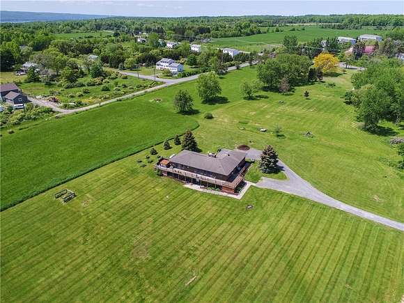 30.62 Acres of Agricultural Land with Home for Sale in Lansing, New York