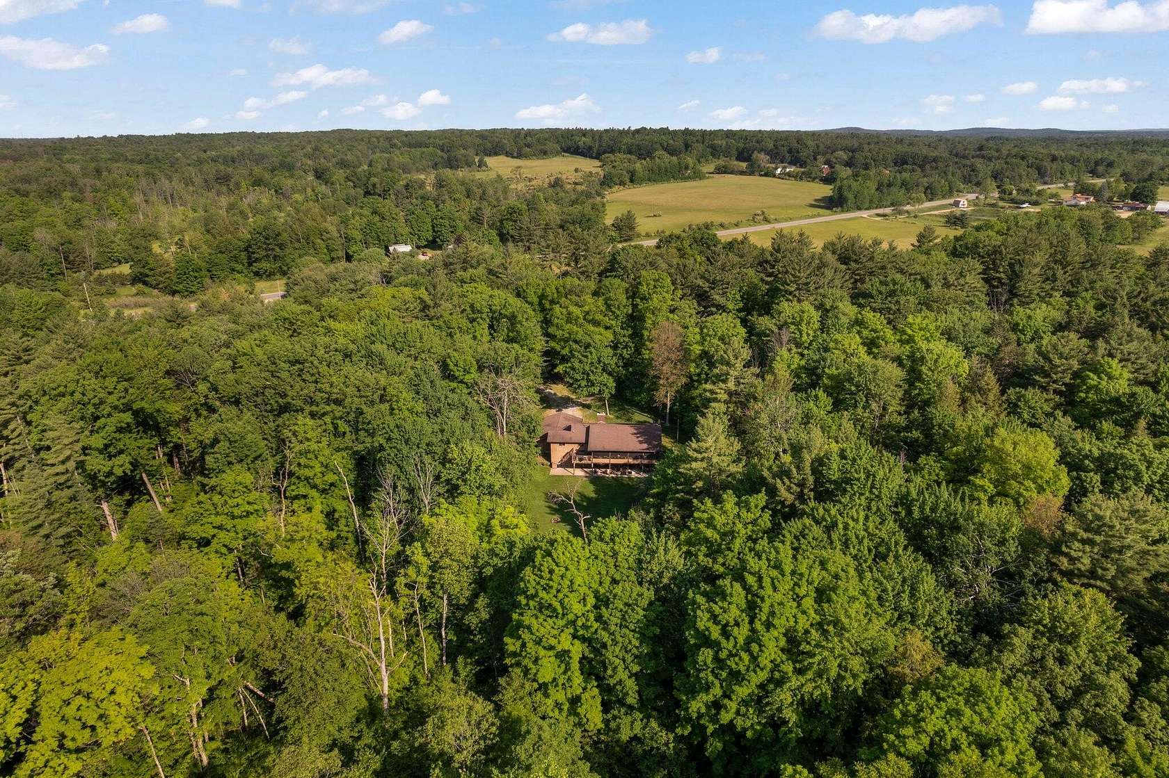 10 Acres of Land with Home for Sale in Stanwood, Michigan