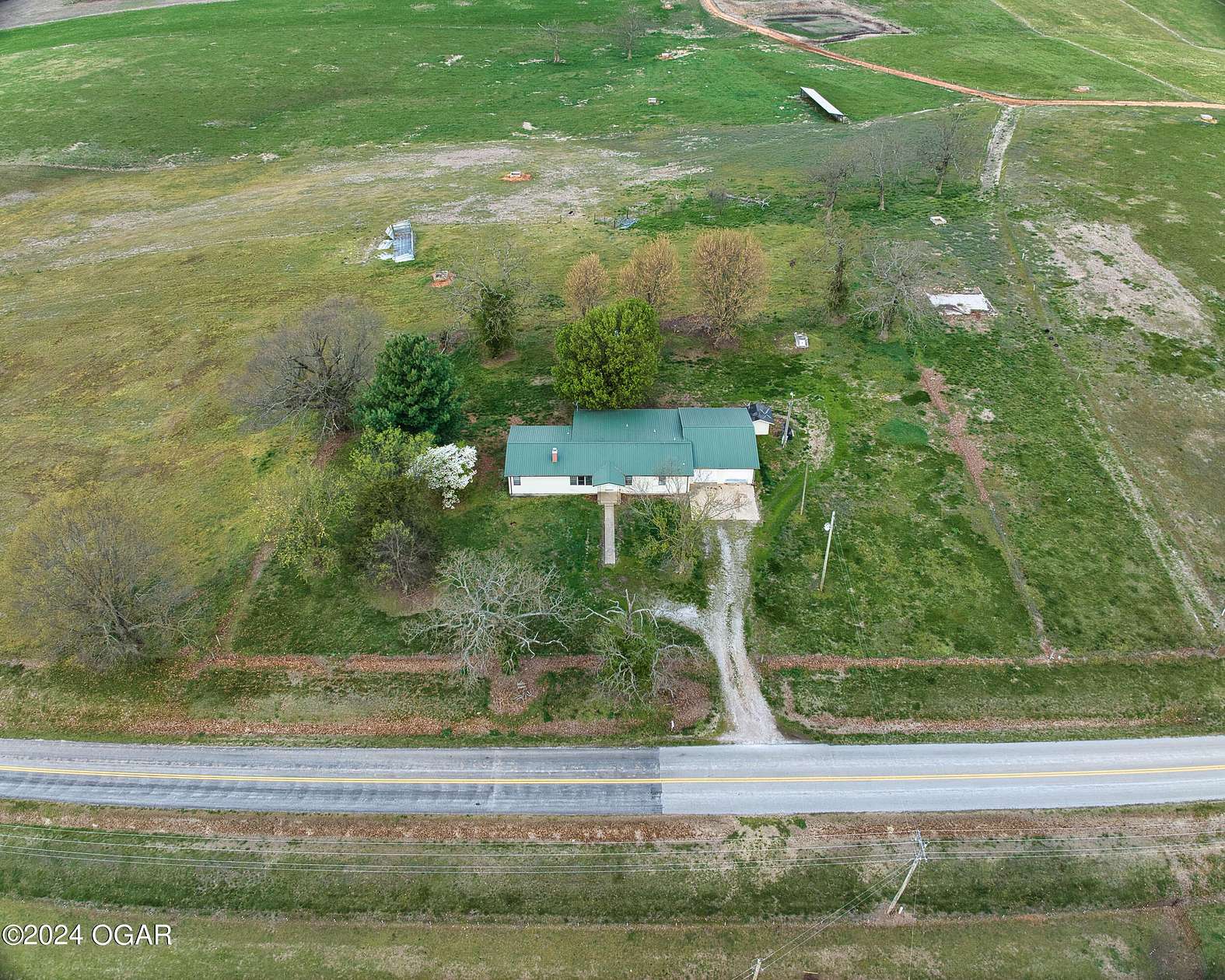 87 Acres of Agricultural Land with Home for Sale in Pierce City, Missouri