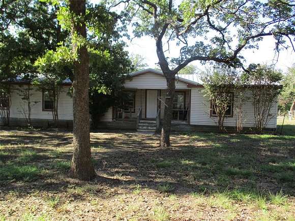 5 Acres of Residential Land with Home for Sale in Paradise, Texas