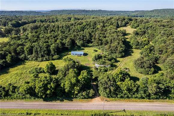 74 Acres of Land with Home for Sale in Altus, Arkansas