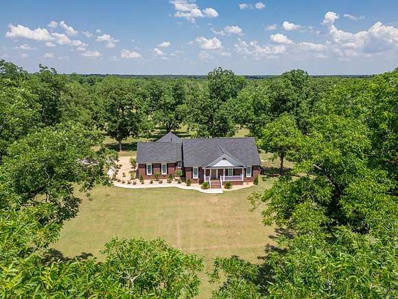 15.58 Acres of Land with Home for Sale in Leesburg, Georgia