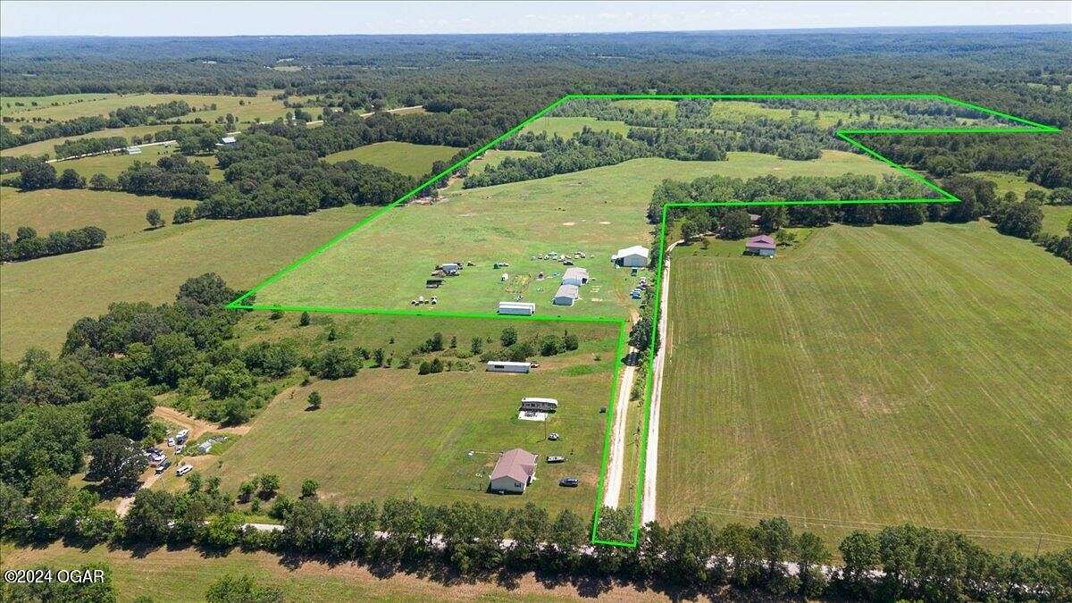 131 Acres of Agricultural Land with Home for Sale in Stella, Missouri