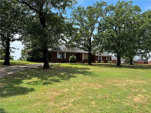 24.97 Acres of Agricultural Land with Home for Sale in Howe, Oklahoma