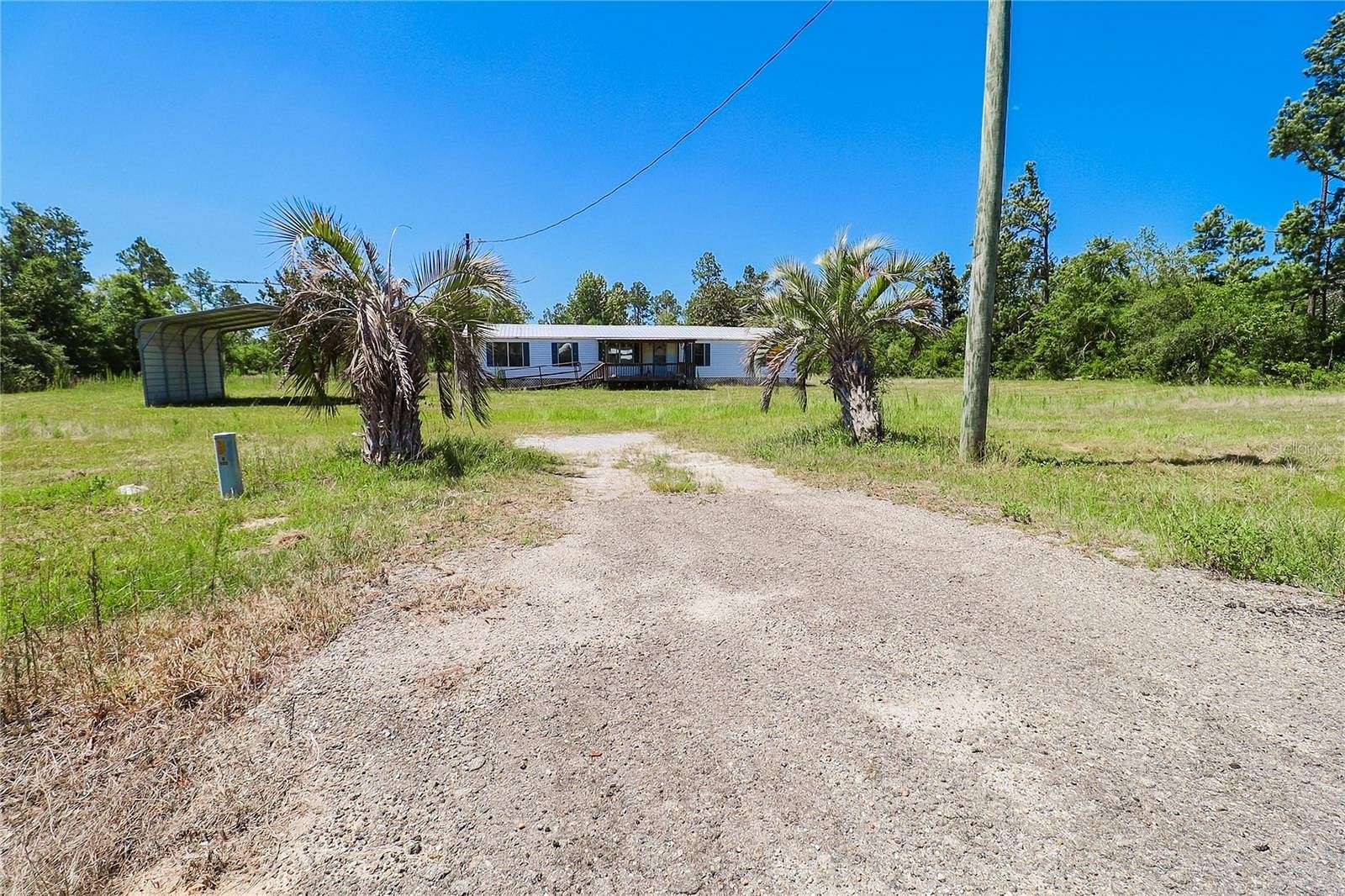 9.86 Acres of Residential Land with Home for Sale in Altha, Florida