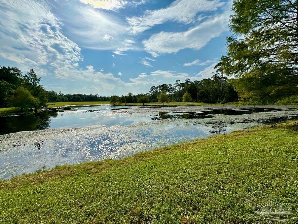 27.32 Acres of Recreational Land with Home for Sale in Pace, Florida