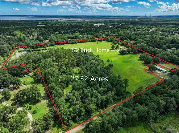 27.32 Acres of Recreational Land with Home for Sale in Pace, Florida