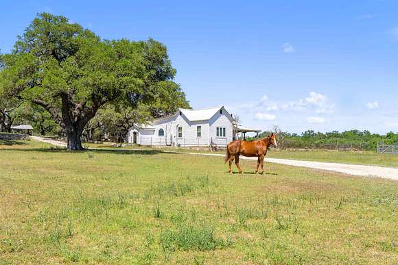 92.05 Acres of Agricultural Land with Home for Sale in Blanco, Texas