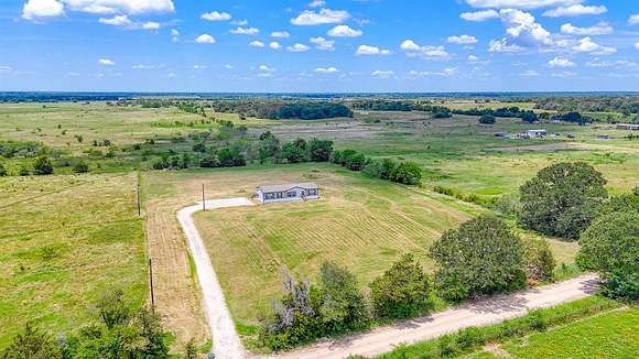 12.742 Acres of Land with Home for Sale in Kerens, Texas