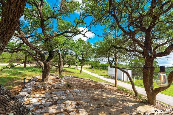 8.972 Acres of Residential Land with Home for Sale in Pipe Creek, Texas