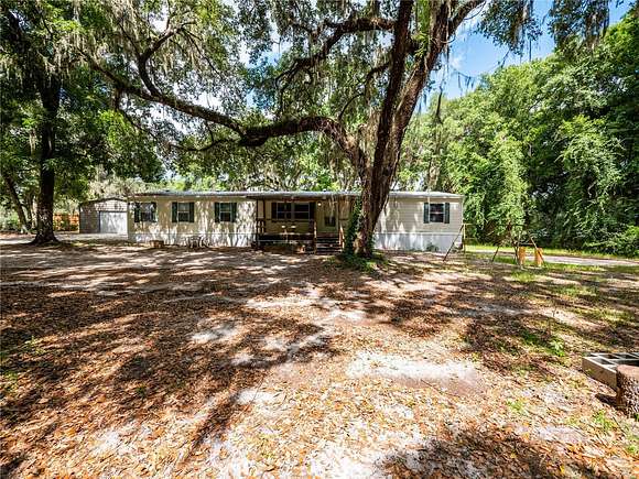 9.96 Acres of Land with Home for Sale in Citra, Florida