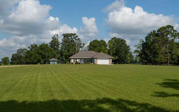80 Acres of Agricultural Land with Home for Sale in Lake City, Florida