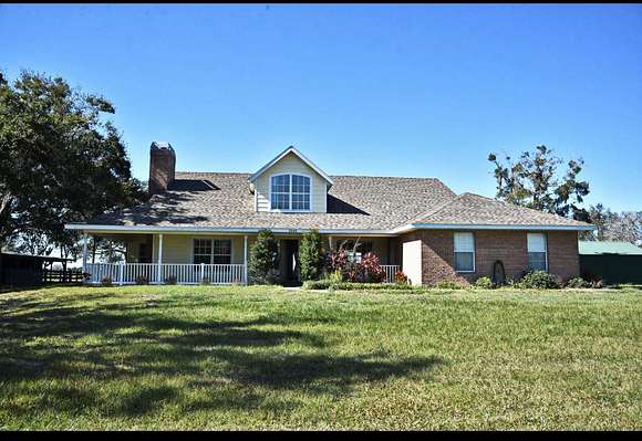 4.7 Acres of Land with Home for Sale in Saint Cloud Oaks, Florida