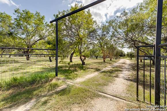 13.241 Acres of Land with Home for Sale in Adkins, Texas