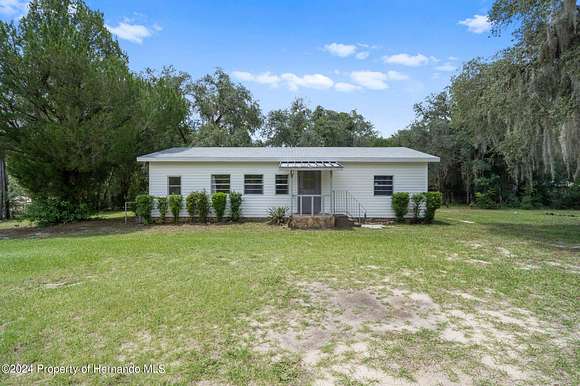 2.5 Acres of Residential Land with Home for Sale in Brooksville, Florida