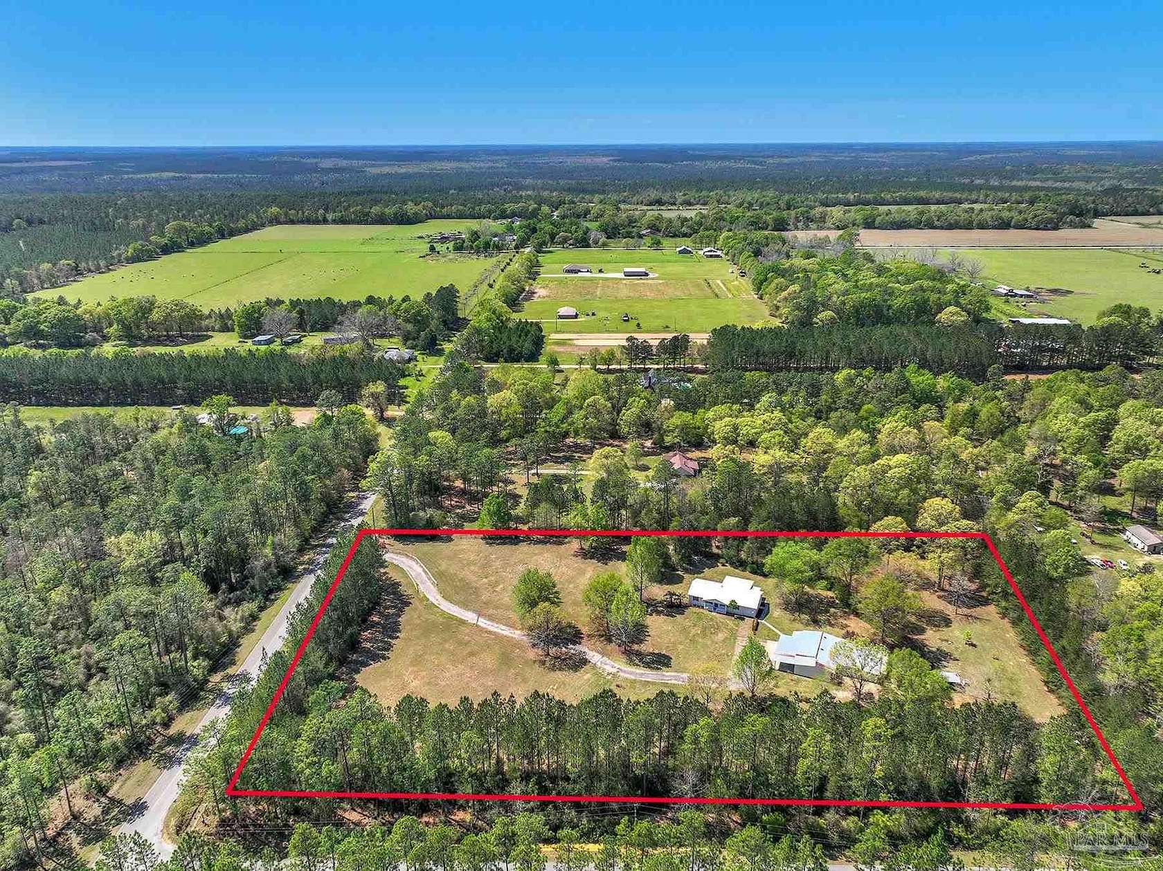 5.66 Acres of Residential Land with Home for Sale in McDavid, Florida