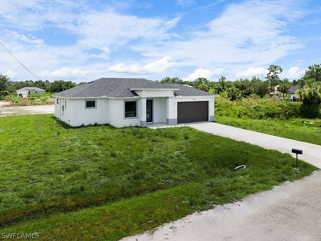 0.5 Acres of Residential Land with Home for Sale in Lehigh Acres, Florida