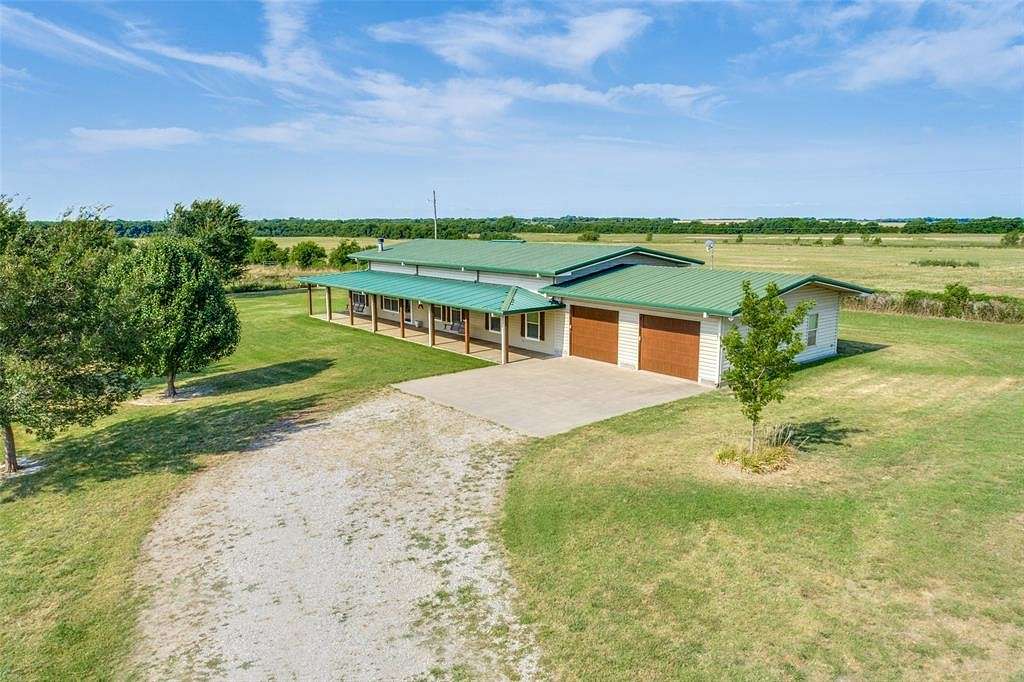 27.761 Acres of Agricultural Land with Home for Sale in Bonham, Texas