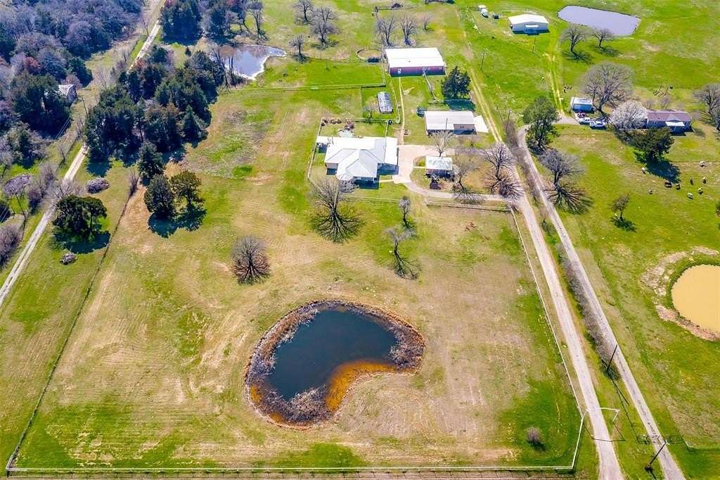 21.546 Acres of Agricultural Land with Home for Sale in Terrell, Texas