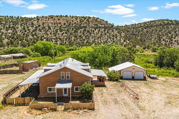 23.83 Acres of Agricultural Land with Home for Sale in La Madera, New Mexico