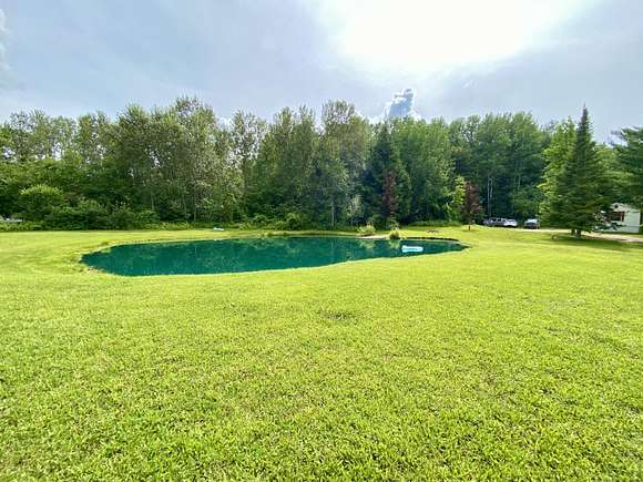 10 Acres of Land with Home for Sale in Harrison, Michigan