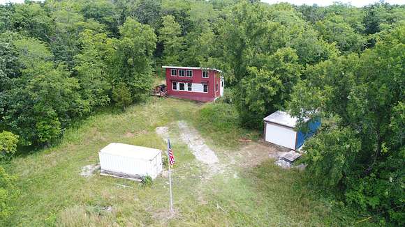 107 Acres of Land with Home for Sale in Green Castle, Missouri