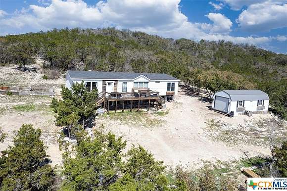 11.76 Acres of Land with Home for Sale in Hondo, Texas