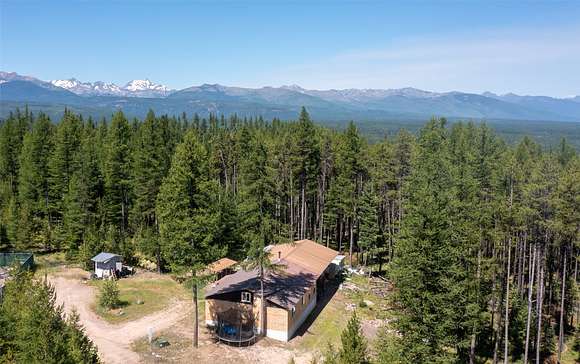 5.48 Acres of Residential Land with Home for Sale in Seeley Lake, Montana