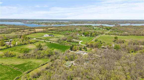 14.82 Acres of Land with Home for Auction in Smithville, Missouri