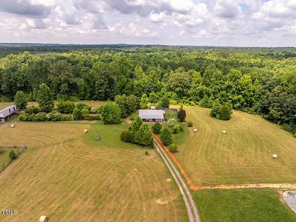 11.2 Acres of Land with Home for Sale in Siler City, North Carolina