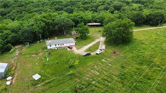 100 Acres of Land with Home for Sale in Freeman, Missouri