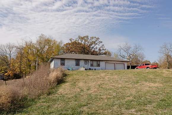 100 Acres of Land with Home for Sale in Freeman, Missouri