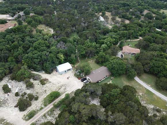 5.77 Acres of Residential Land with Home for Sale in Granbury, Texas