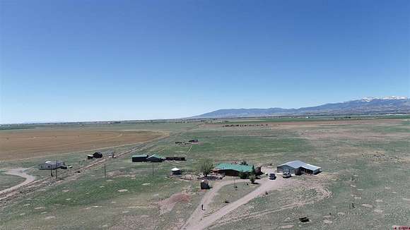 60 Acres of Agricultural Land with Home for Sale in Del Norte, Colorado