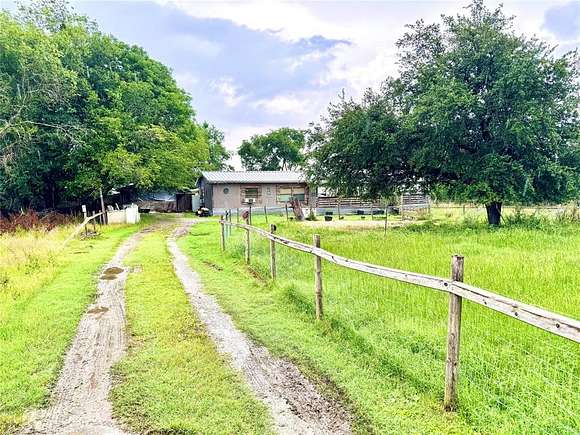 2 Acres of Residential Land with Home for Sale in Wortham, Texas