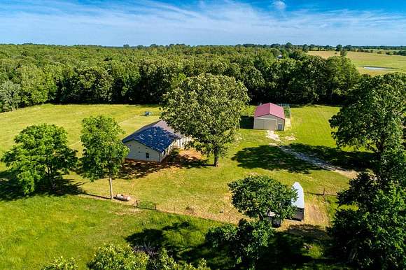 80 Acres of Agricultural Land with Home for Sale in Peace Valley, Missouri
