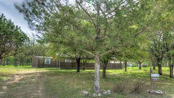 2 Acres of Residential Land with Home for Sale in Leakey, Texas