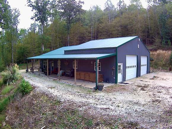 75.36 Acres of Recreational Land with Home for Sale in Big Sandy, Tennessee